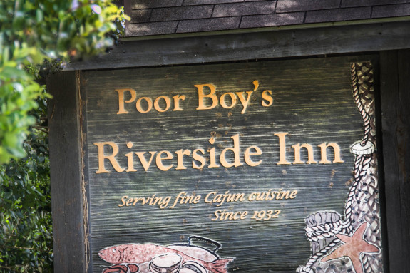 Poor Boy's Riverside Inn sign