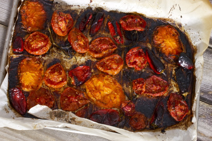 Roasted tomatoes for a Blackened Bloody Mary -- a classic cocktail with Cajun recipe flavors.