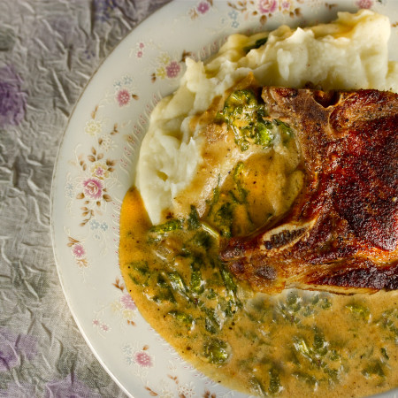Pan-Griddled Pork Chops with Goat Cheese Mashed Potatoes and Mustard Green Gravy