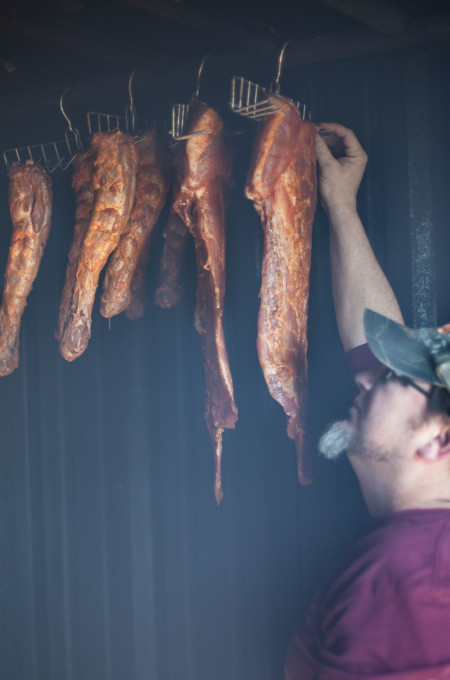 Turkey necks are one of the Cajun recipe ingredients that are key to Cajun cooking and Smoked Turkey Neck Gumbo. Jean Duos in his smokehouse prepping a classic Cajun recipe ingredient for Smoked Turkey Neck Gumbo..