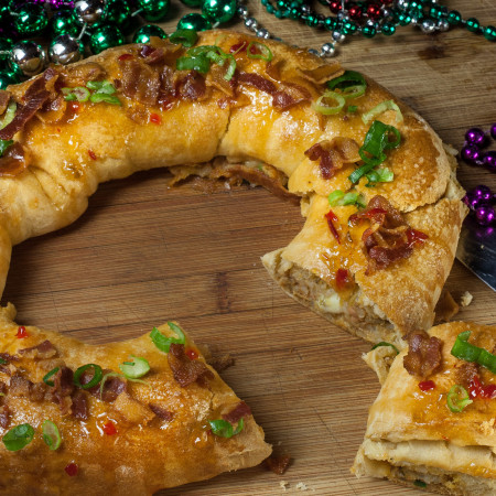 Cheese-stuffed boudin regally encased in crusty pepper jelly-glazed bread -- the king of all cakes.