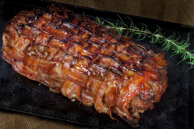 Bacon-Wrapped Meat Loaf Wrapped in bacon and glazed with sweet heat, this Bacon-Wrapped Meat Loaf spikes with Cajun recipe flavor. (All photos credit: George Graham)