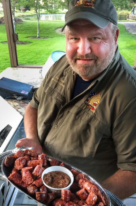 Jay Owen, the steakmaster, serving up a sausage appetizer at the lodge.