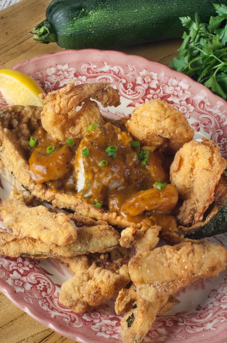 Shrimp and Zucchini Pirogue with fries With a side of zucchini fries, this Cajun recipe for Shrimp and Zucchini Pirogue is perfection on a platter.