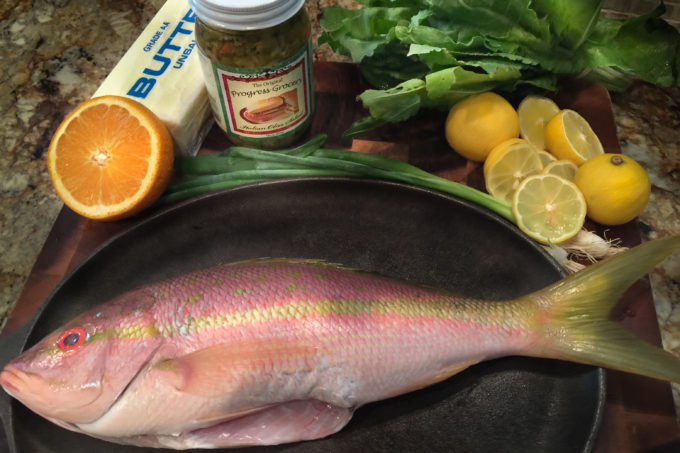 Yellowtail snapper Colorful yellowtail snapper combine with equally colorful ingredients--perfect for a Cajun recipe.