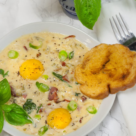 Baked Eggs in Tasso Cream features Savoie’s Smoked Tasso