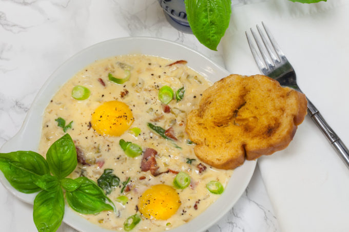 Smoked tasso with a kick of Cajun spice is the key to this egg dish--a classic Baked Eggs in Tasso Cream recipe. (All photos credit: George Graham)