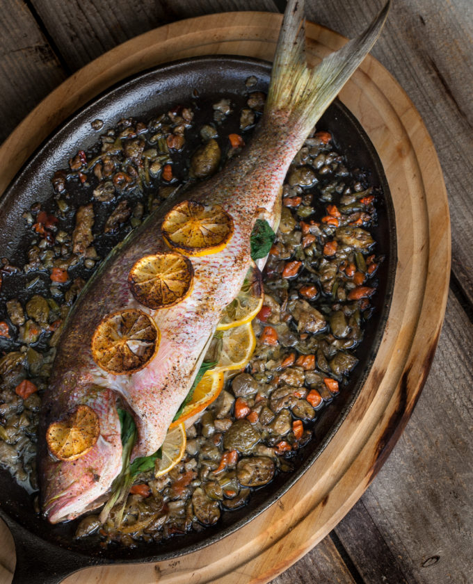 Baked Yellowtail Snapper platter Whole fish cooked on the bone is always sweeter and tastier. Give this Baked Yellowtail Snapper recipe a try.