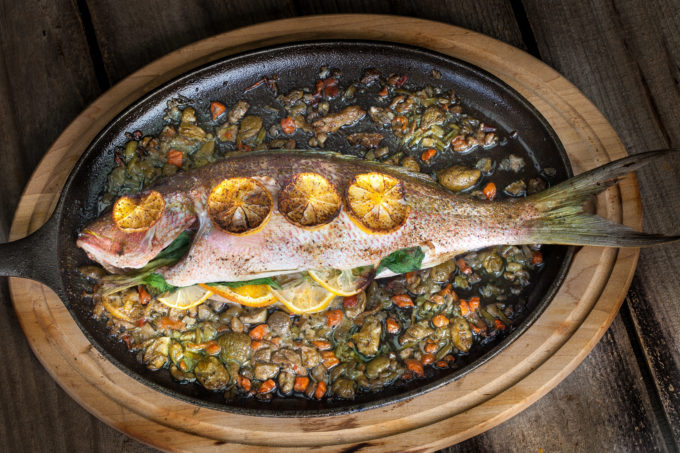Baked Yellowtail Snapper Oven-baked and stuffed with flavor, this Baked Yellowtail Snapper is a classic Cajun recipe. (All photos credit: George Graham)