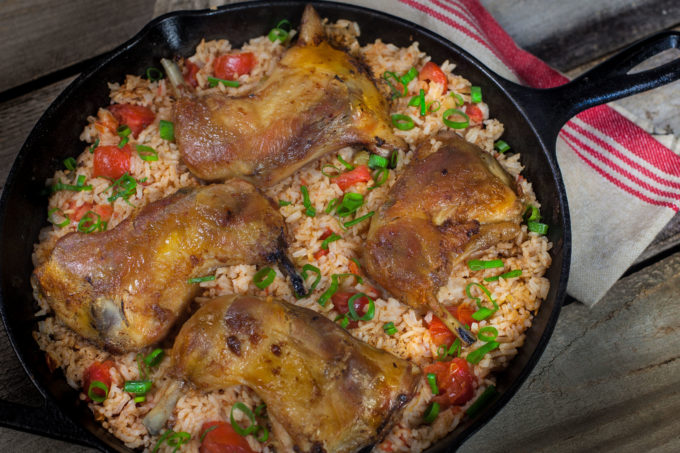 Crisp Chicken Thighs Crisp chicken thighs top rich tomato-infused Louisiana jasmine rice in this classic Creole recipe. (All photos credit: George Graham)