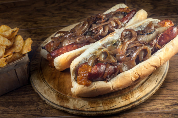 Piled high with grilled onions, my smoked sausage po'boy is a Cajun recipe classic. (All photos credit: George Graham)