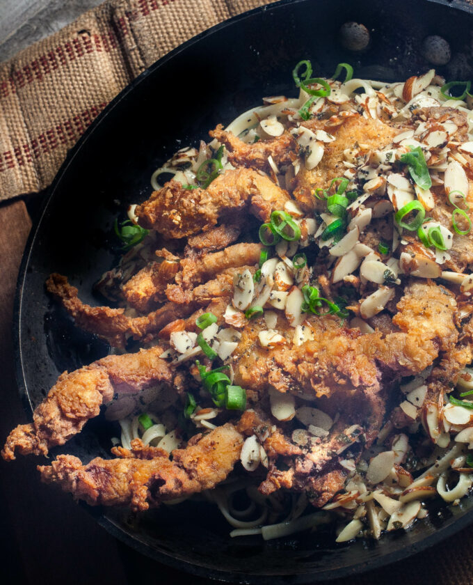 The rich butter sauce coats the pasta and provides the perfect bed for the crispy softshell crab.