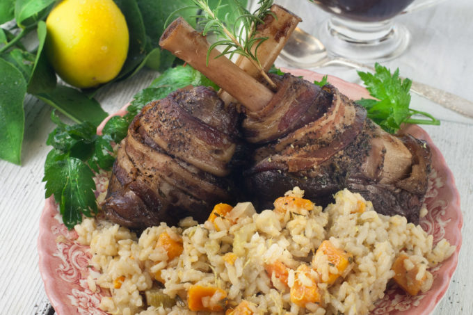 Not a typical Cajun recipe, Bacon-wrapped lamb shanks on the bone smoked in pecan wood pairs perfectly with sweet potato risotto. (All photos credit: George Graham)