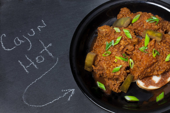 Cajun Hot Chicken Drenched in a bath of liquid napalm, this explosive Cajun Hot Chicken recipe just might be your new favorite fried chicken. (All photos credit: George Graham)