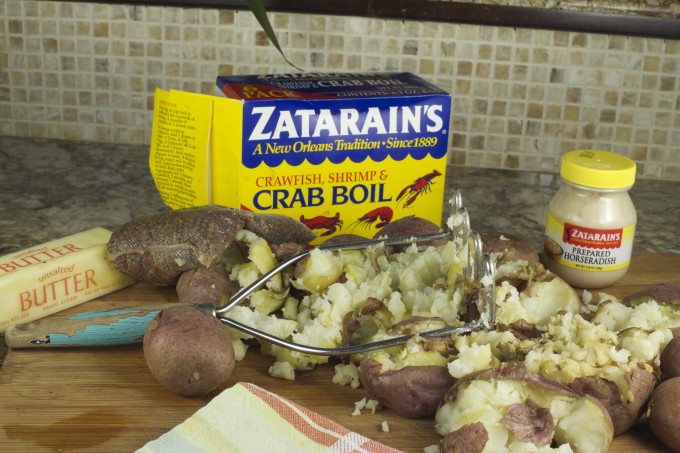 A double dose of crab boil seasoning and horseradish elevate these potatoes to the heights of a Cajun recipe for Alligator Sausage and Creole Red Onions.