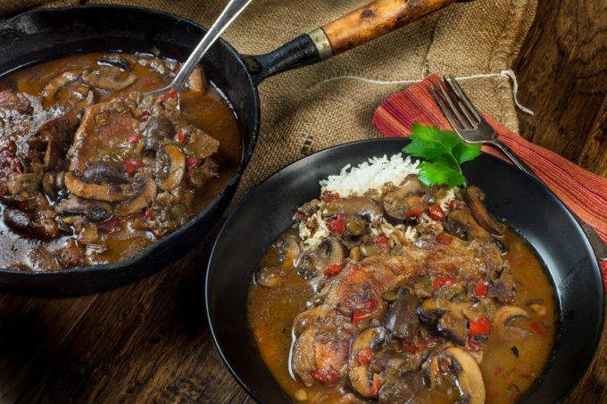 Pork chops and mushrooms in a deep dark gravy is welcome comfort in a classic Cajun recipe. (All photos credit: George Graham)