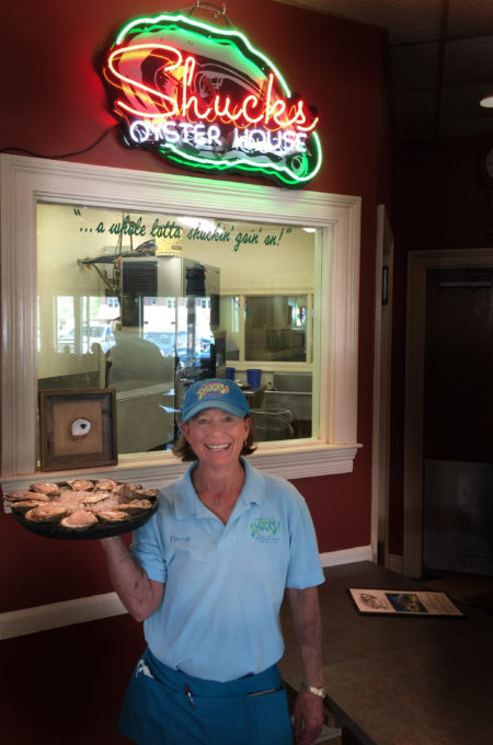 Rene with Shucks Oyster House Rene brings 'em out a dozen at a time!