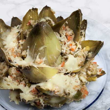 Oven-baked and dripping with olive oil , this simple stuffed artichoke explodes with flavor.  (All photos credit: George Graham)
