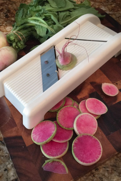 Slicing with a mandoline Using a kitchen mandoline makes slicing quick and easy.