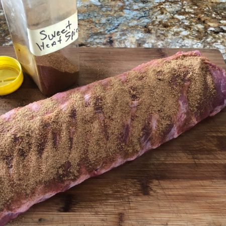 Apply the rub generously and massage in the flavor.