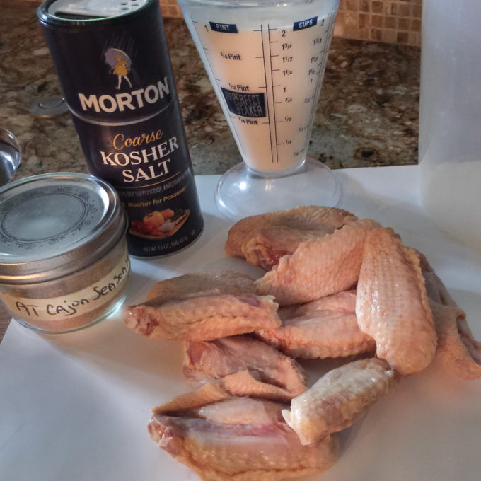 Wing brine with buttermiilk and salt and Cajun spice. A spicy buttermilk brine packs in the flavor.