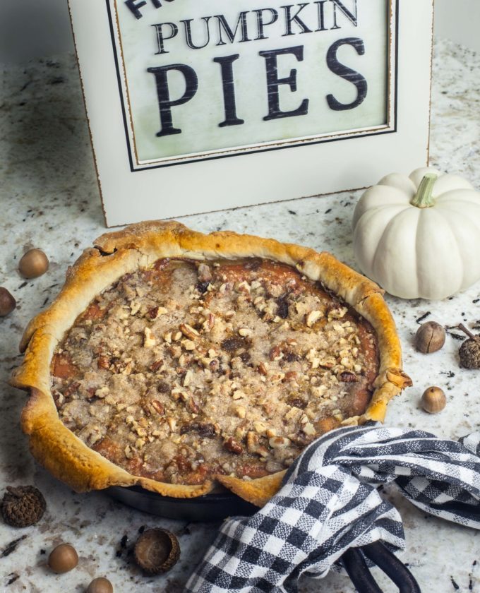 This Praline Pumpkin Pie baked in a black iron skillet is like a taste of the fall season.