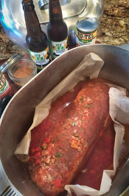 Stuffed, bathed in beer, and spiked with diced tomatoes, this Beer-Braised Stuffed Brisket bakes for 3 hours.