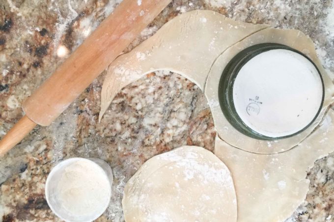 Cut the pie dough just an inch larger than your vessel to seal your crust.