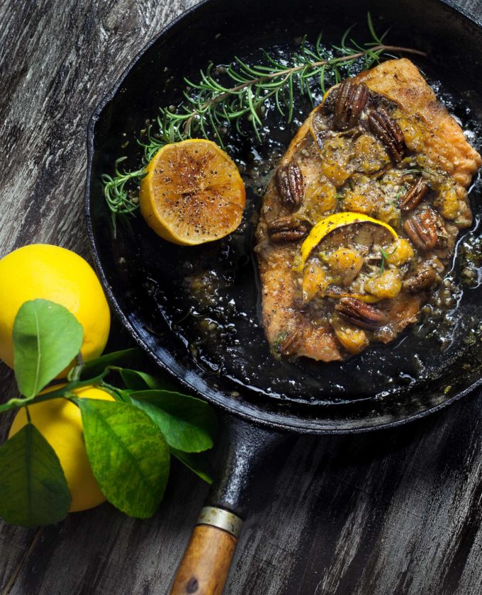 Bathed in citrus butter and Louisiana pecans, this Catfish Fillets in Satsuma-Lemon Meunière Sauce tames the wild catfish.