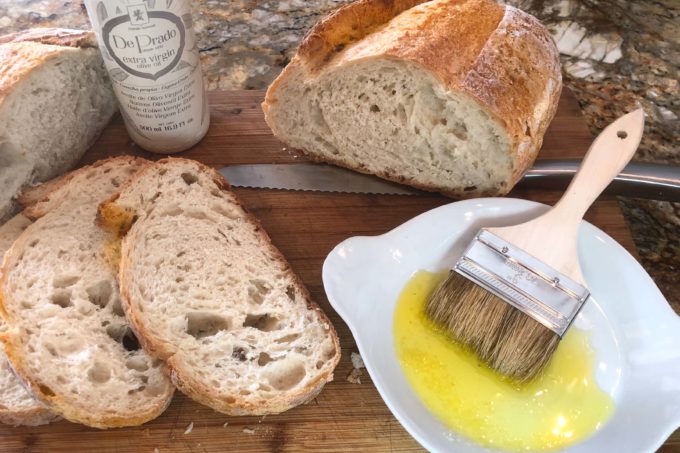 Hand-sliced and brushed with olive oil, my sourdough is ready for a quick grilling.