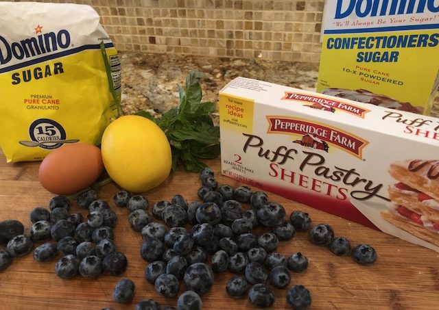 Store-bought puff pastry combines with simple pantry ingredients for dramatic (and simple) results in this Blueberry Basil Pastry.