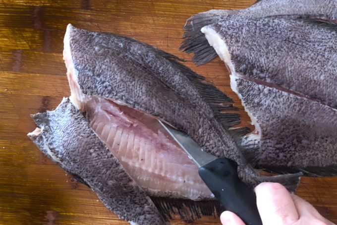 Filleting flounder is easy; just slide the boning knife under the skin and follow the bones as your guide.