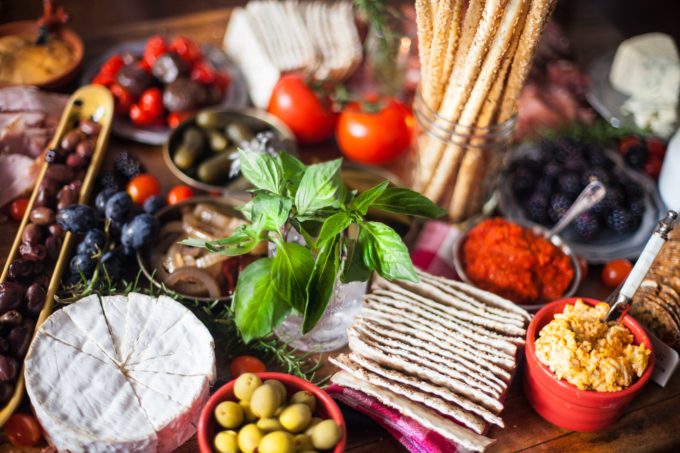 Charcuterie board closeup Be creative and layer exotic flavors onto your table.