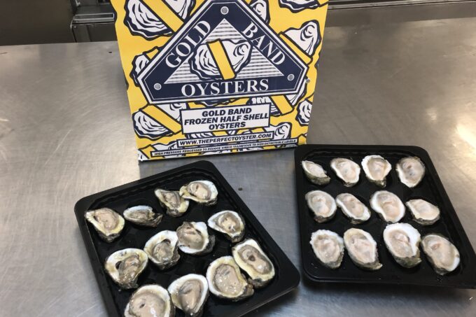 Gold Band flash-frozen oysters on the half-shell are sorted on trays and boxed for shipping. (Photo credit: George Graham)