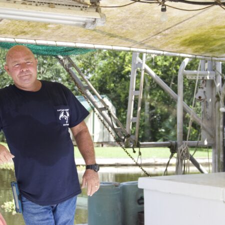 Captain Quincy on his boat on Bayou Dularge in Theriot, LA. (Photo credit: George Graham)