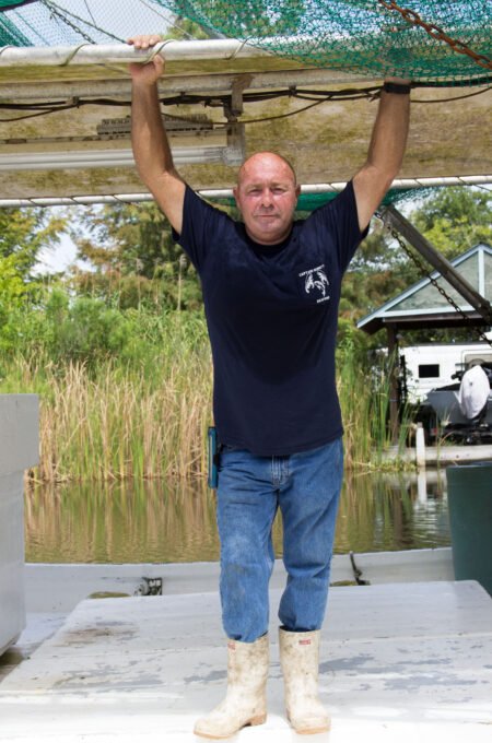 Captain Quincy on his fishing boat the MISS SHARON. (Photo credit: George Graham)